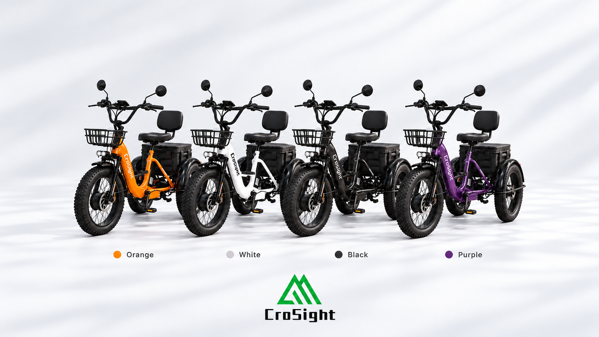 Four CroSight electric trikes in orange, white, black, and purple, displayed with front baskets and rear cargo storage.